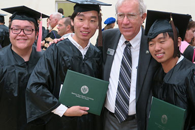 Dr. Gamble celebrates with ENMU graduates