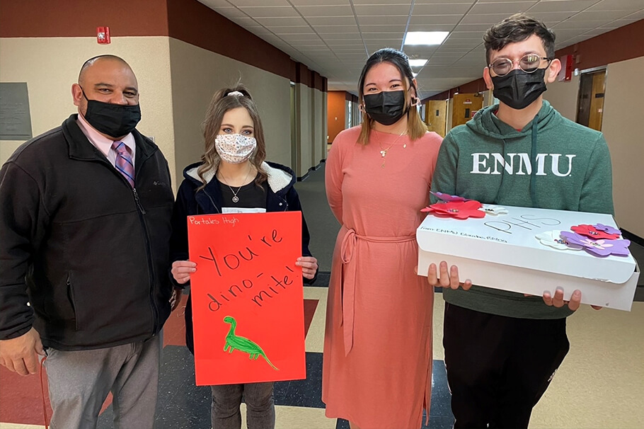 ENMU students visit local schools to deliver cookie boxes and cards.