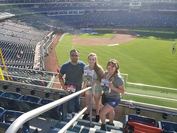 Dr. Camarillo with students at game