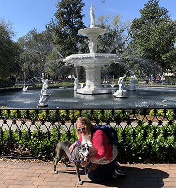 maggie coughlin with pet at park