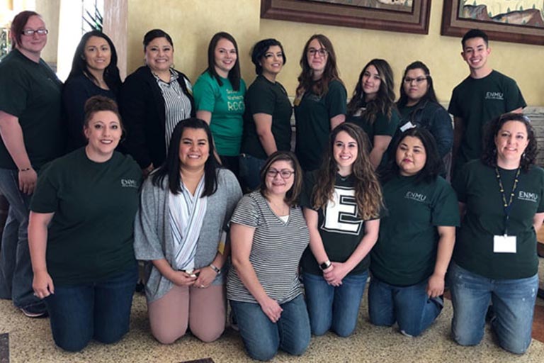 Top Row L-R:  NiCole Ryan (senior), Sarena Garcia (junior), Rebecca Cobos (alumna), Victoria Holt (senior), Eden Borunda (senior), Micah Terry (junior), Alexis Lucero (senior), Laura Olivas (senior), Paul Gallegos (alumnus) Bottom Row L-R:  Tyleen Caffrey (instructor of social work), Edith Cope (junior), Janice Martinez (alumna), Marla Duke (senior), Mariah Walters (senior), Carolyn Tollett (instructor of social work)