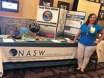 social work instructor tyleen caffrey at display table