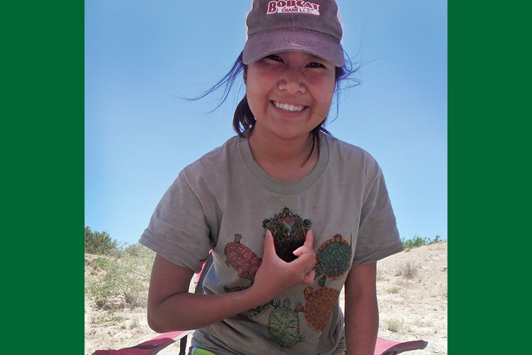 Thanchira Suriyamongkol holding a Rio Grande River Cooter.