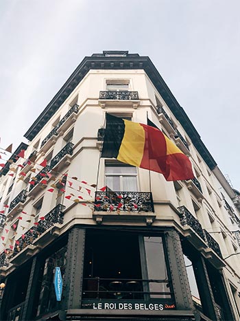 trip belgian flags on brussels building