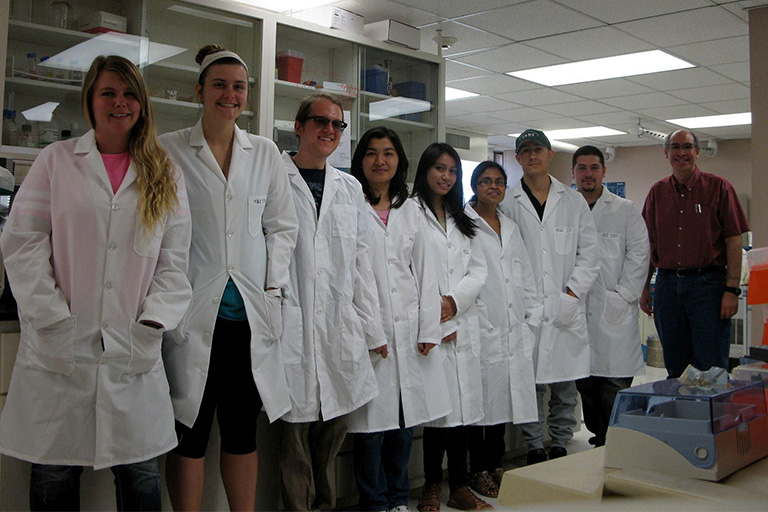 Dr. Manuel Varela with some of his students.