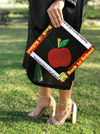 amanda gonzales with decorated graduation cap