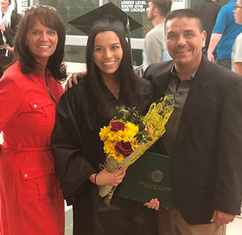 amanda gonzales with parents at graduation