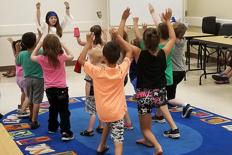 Danielle Castro leading a pirate yoga session (pre-pandemic).