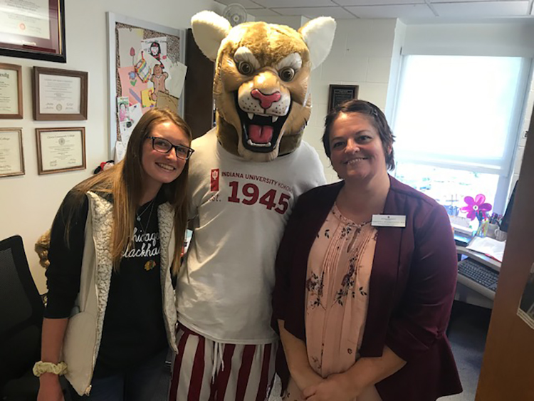 dr cristina romero ivanova with student and mascot