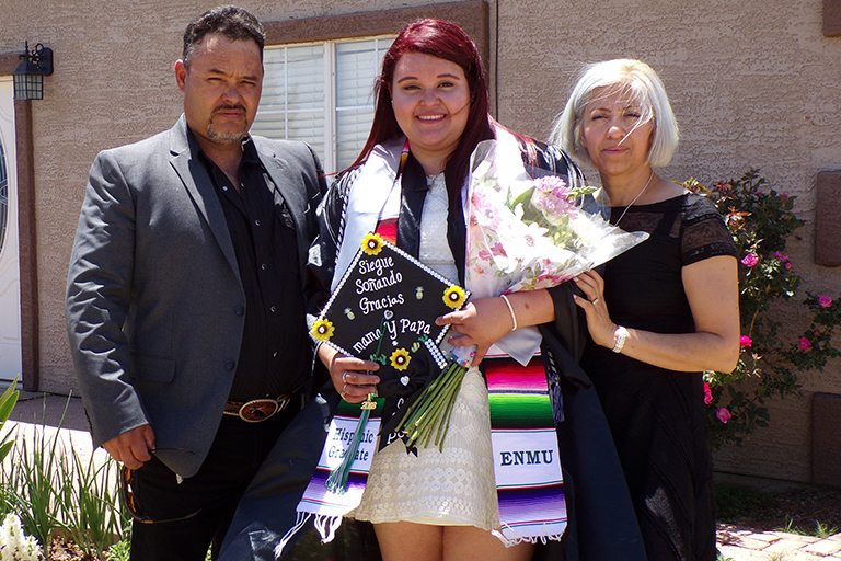 Eleny Ceniceros De La Cruz with her parents as she was graduating with a bachelor’s degree in 2018.