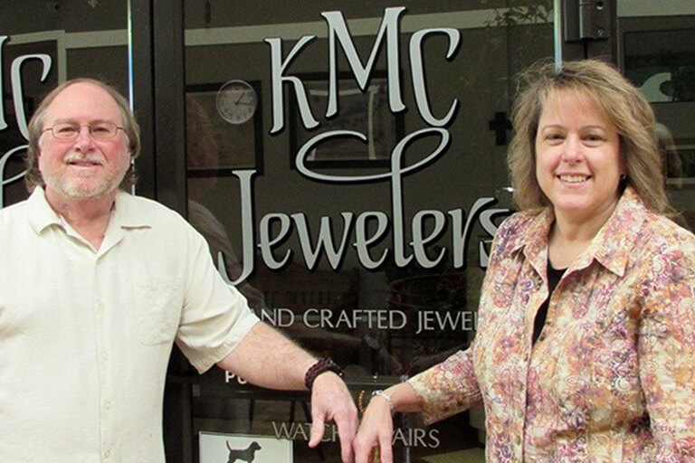 Mrs. Michelle (Lacko) Isherwood with her husband, Kurt, at the former storefront of their business.