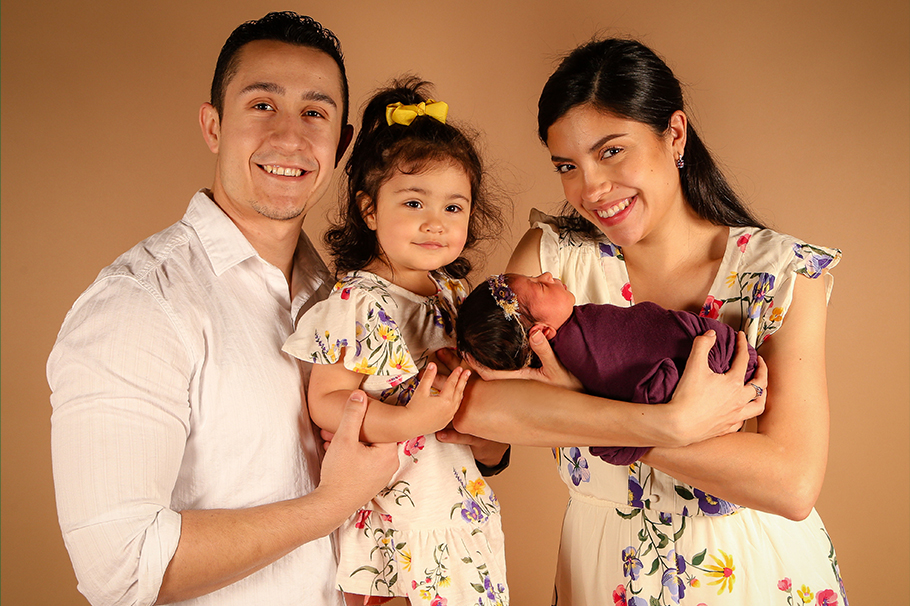 John Garcia with his wife and fellow Greyhound Grad, Katrina "Minnie," and their daughters, Stevie and Siana.