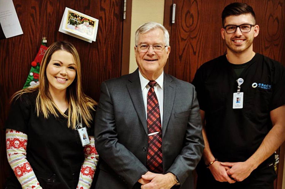 River Fine (right) at his job at Grace Clinic in Lubbock, where he works for Dr. Carr (middle) and Amie (left). 