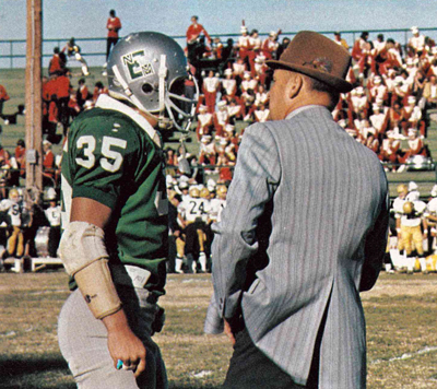 Defensive captain Steve Loy, left, discusses strategy with defensive coordinator Chuck Shelton.