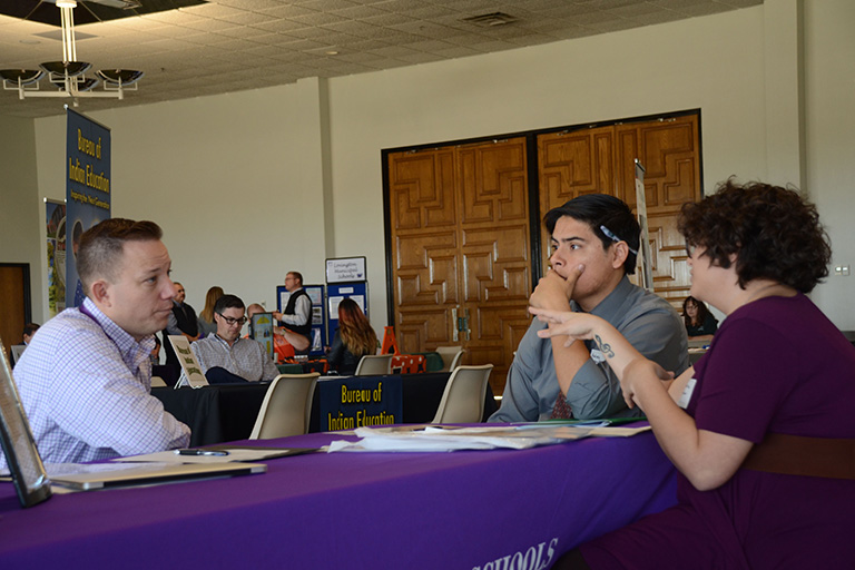 An interview taking place at ENMU’s Career Fair.