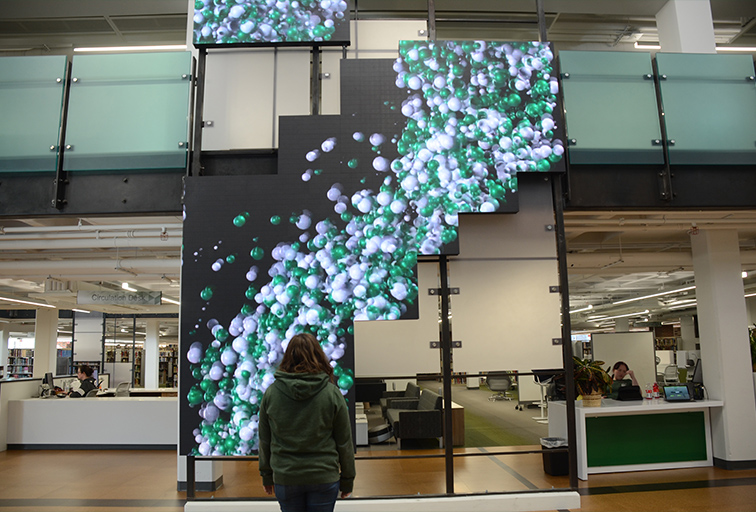 Student in front of screens