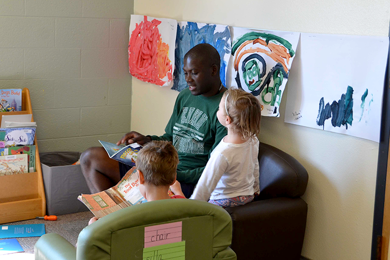 ENMU Student Reading to Children