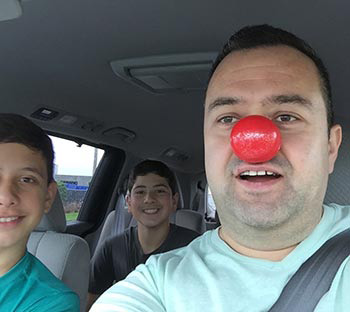 dr duni with nephews wearing red nose