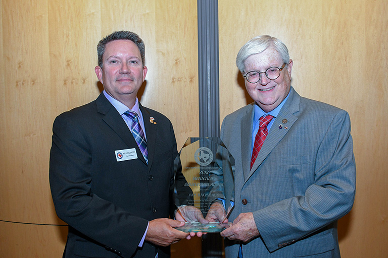 Van Ragsdale, right, receiving the Texas Bandmasters Association (TBA) 2018 Meritorious Achievement Award at the TBA conference in July. 