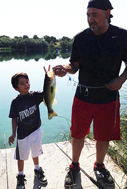 Robert Armijo fishing with son Brennan