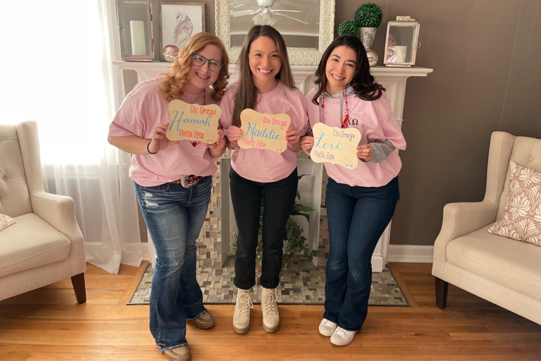 Alexis Autumn Romero, right, with her Chi Omega sisters.