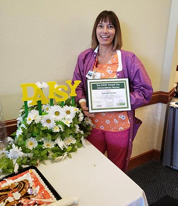 sabrina daniel with award