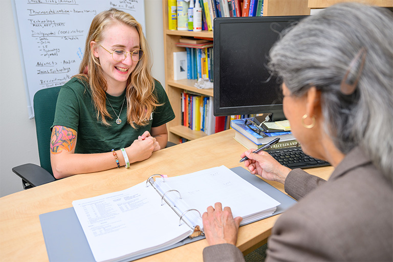 Student receiving assistance from an instructor