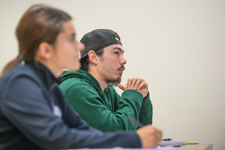 student listening to lecture in class