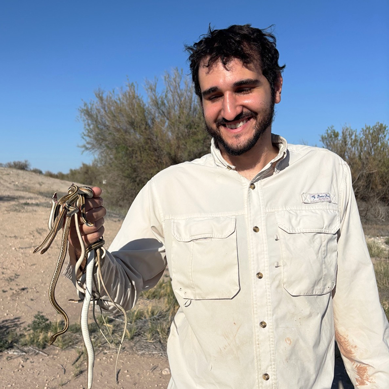 Sebastian Summo-Elias with a handful of Ribbon Snakes