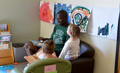 ENMU Student Reading to Children