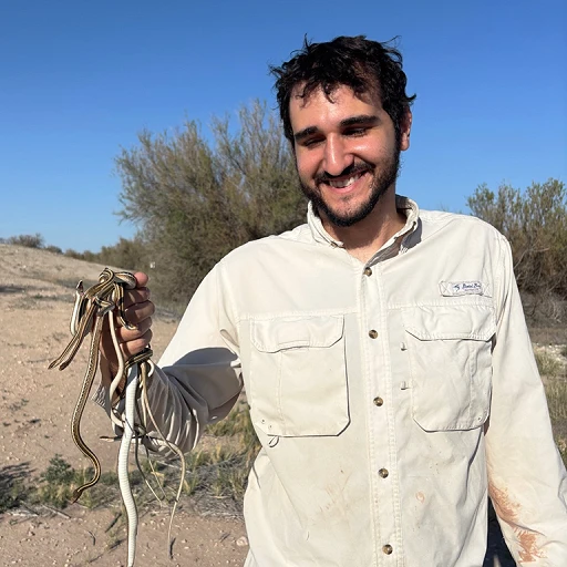 Sebastian Summo-Elias with a handful of Ribbon Snakes